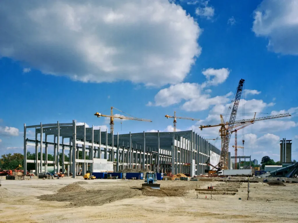 Construction site with workers and equipment.