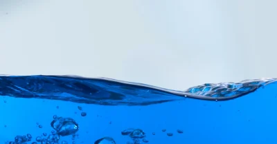 The blue liquid in porta potties is a specially formulated deodorizer that controls odors and enhances sanitation, ensuring a fresher restroom experience.